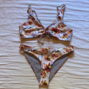 Reversible swimsuit floral and black/white stripes